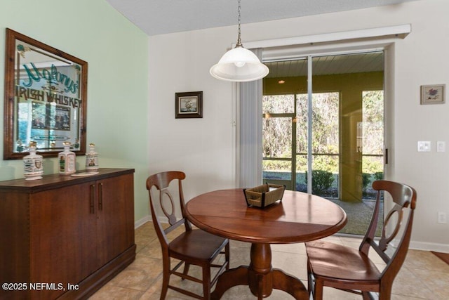 dining area with light tile patterned floors