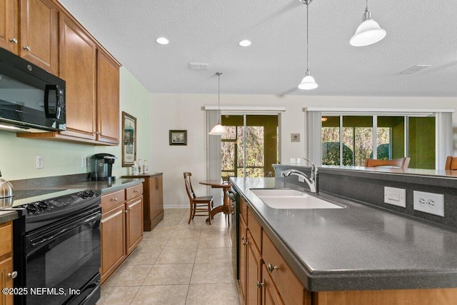 kitchen with decorative light fixtures, a textured ceiling, a kitchen island, black appliances, and sink