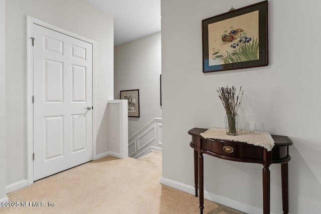 corridor with light colored carpet