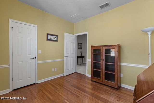 empty room with hardwood / wood-style flooring