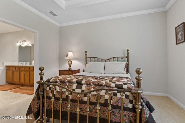 carpeted bedroom with ensuite bath, sink, and crown molding