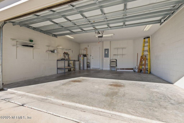 garage with water heater, a garage door opener, and electric panel