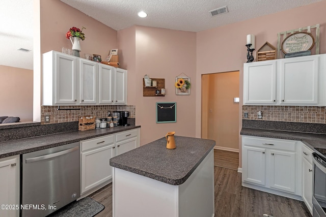 kitchen with decorative backsplash, white cabinets, a textured ceiling, dark wood-type flooring, and dishwasher