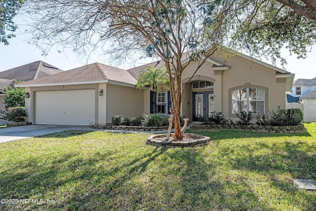 single story home with a garage and a front lawn