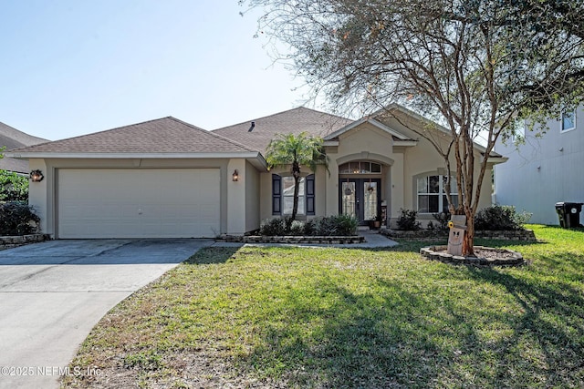 ranch-style house featuring a front yard, french doors, and a garage