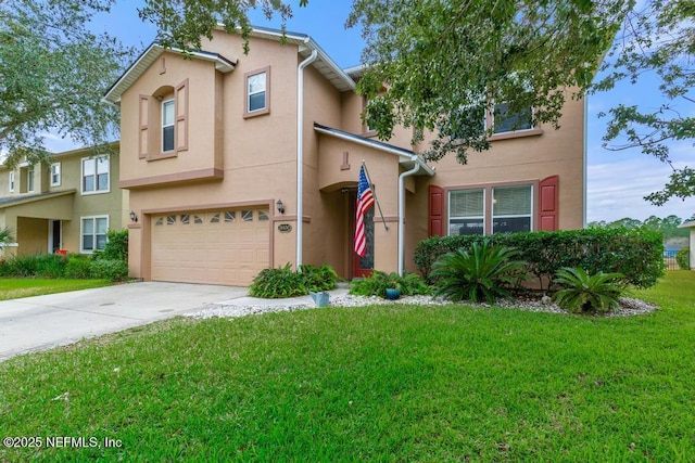 view of front of property featuring a front yard and a garage