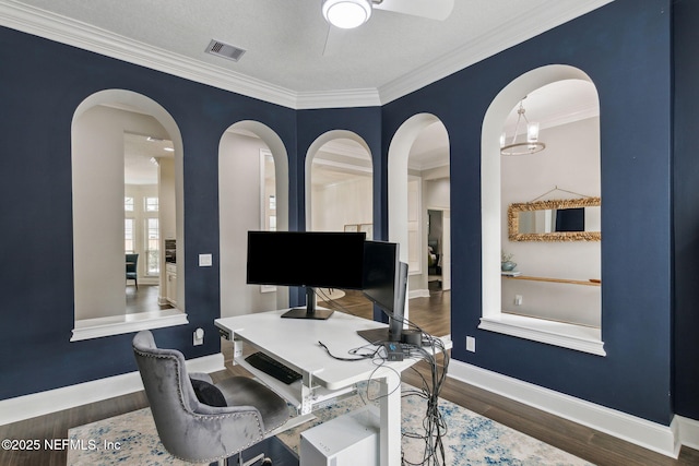 office featuring a chandelier, crown molding, dark wood-type flooring, and a textured ceiling