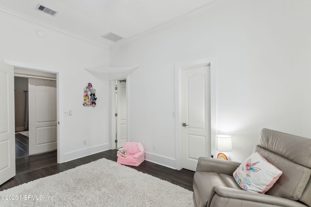 interior space with crown molding and dark hardwood / wood-style flooring