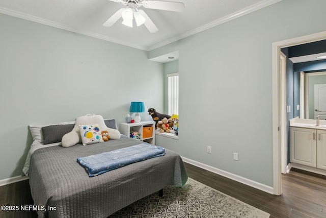 bedroom featuring connected bathroom, ceiling fan, sink, dark hardwood / wood-style floors, and crown molding