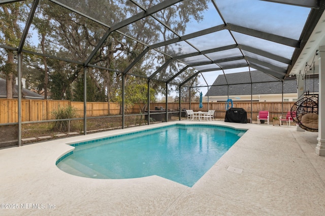 view of swimming pool with a lanai, area for grilling, and a patio