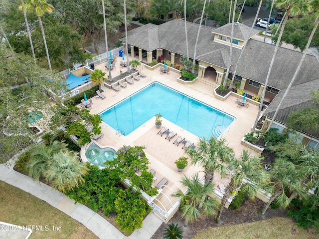 view of swimming pool featuring a patio and area for grilling