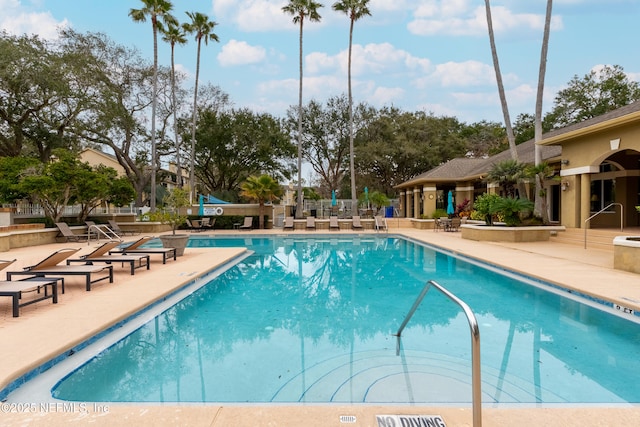 view of swimming pool with a patio area