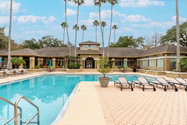 view of swimming pool with a patio area