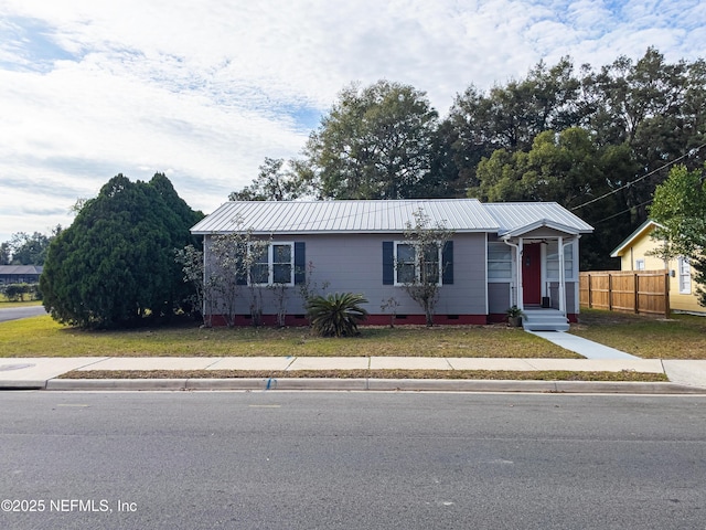 ranch-style home with a front yard