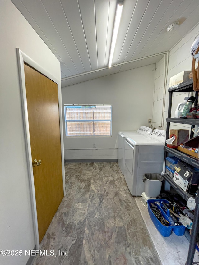 clothes washing area with independent washer and dryer and wood ceiling