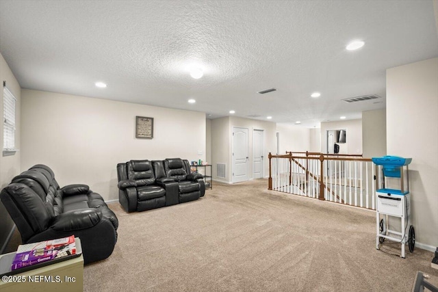 living room featuring a textured ceiling and light colored carpet