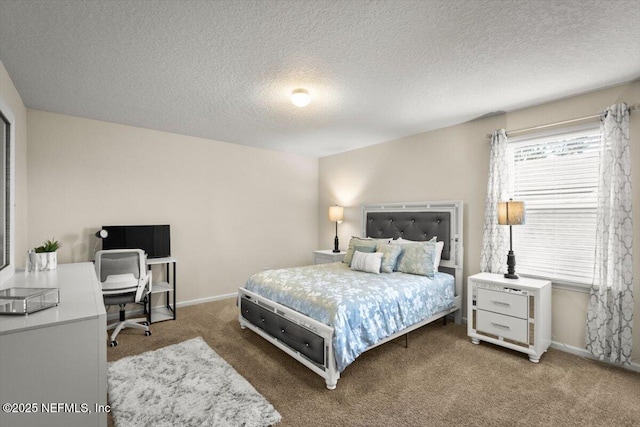 bedroom with carpet floors, a textured ceiling, and multiple windows