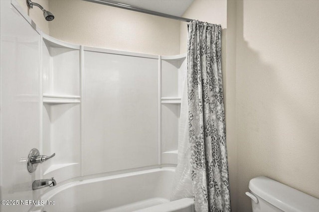 bathroom featuring toilet and shower / bathtub combination with curtain