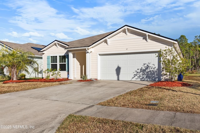 single story home with a garage and a front lawn