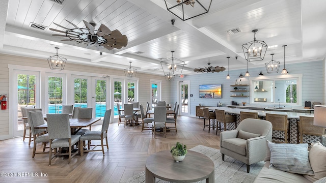 living room with ceiling fan and parquet floors