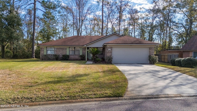 single story home with a garage and a front lawn