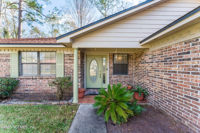 doorway to property featuring covered porch