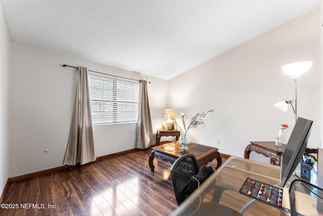 sitting room featuring a textured ceiling, vaulted ceiling, and dark hardwood / wood-style floors