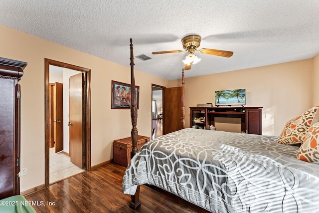 bedroom featuring ceiling fan, a textured ceiling, and wood-type flooring