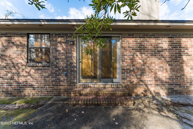 doorway to property featuring a patio area