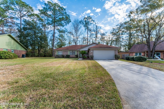 ranch-style home with a garage and a front lawn