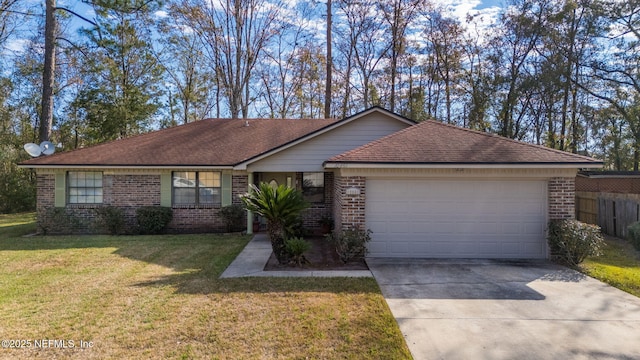 single story home with a garage and a front lawn