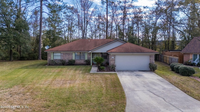 ranch-style home with a garage and a front lawn