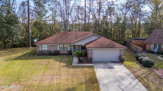 single story home featuring a front lawn and a garage