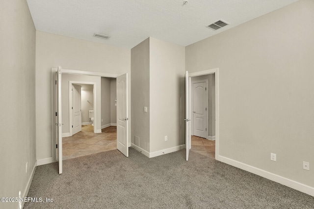 unfurnished bedroom with carpet flooring