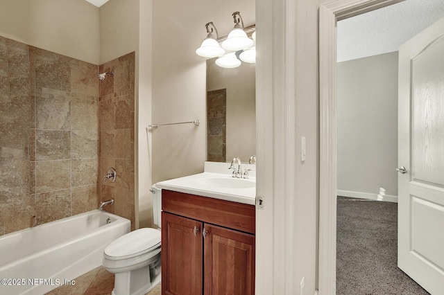 full bathroom with toilet, vanity, and tiled shower / bath