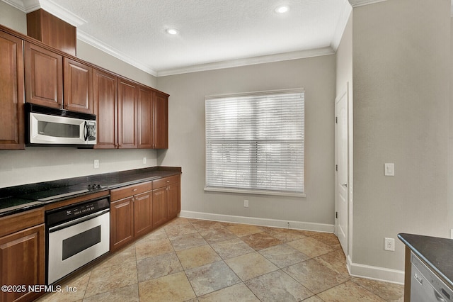 kitchen with a textured ceiling, stainless steel appliances, dark stone counters, and crown molding