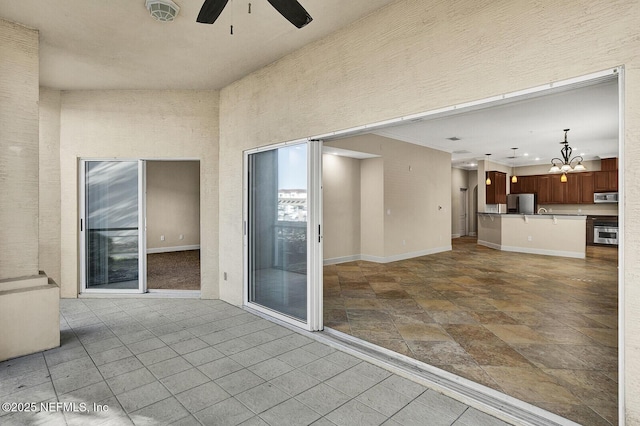 view of patio featuring ceiling fan