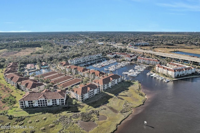 birds eye view of property featuring a water view