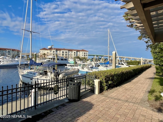 view of patio / terrace featuring a dock and a water view