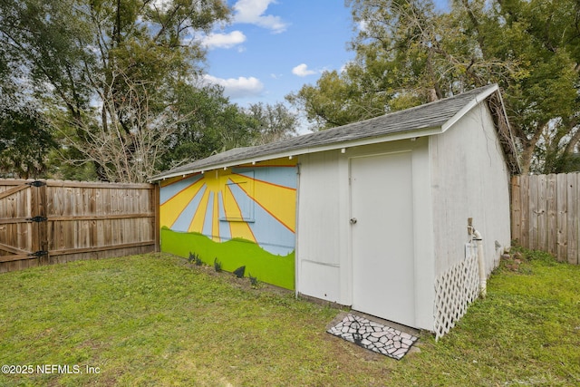 view of outbuilding featuring a lawn