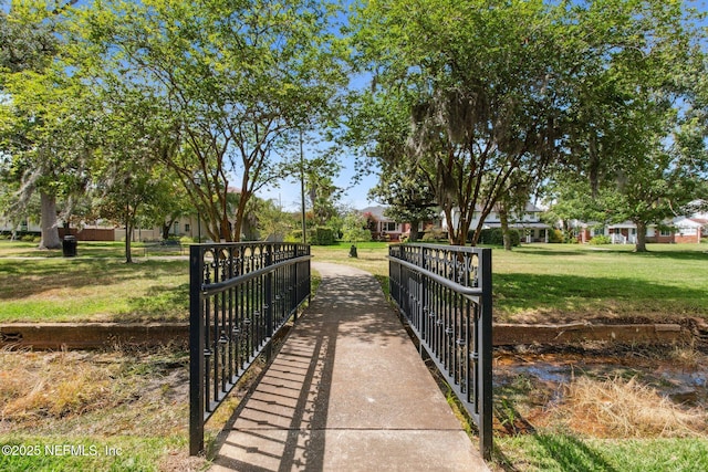 view of home's community featuring a lawn