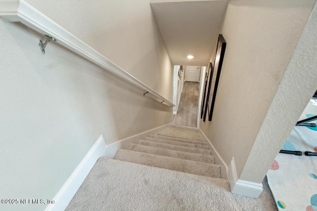 staircase with baseboards