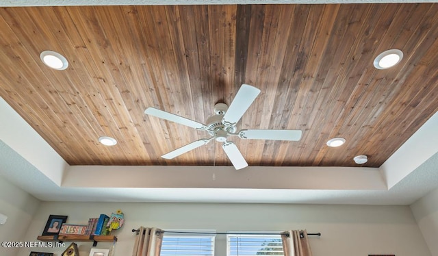 details with wooden ceiling, ceiling fan, a tray ceiling, and recessed lighting