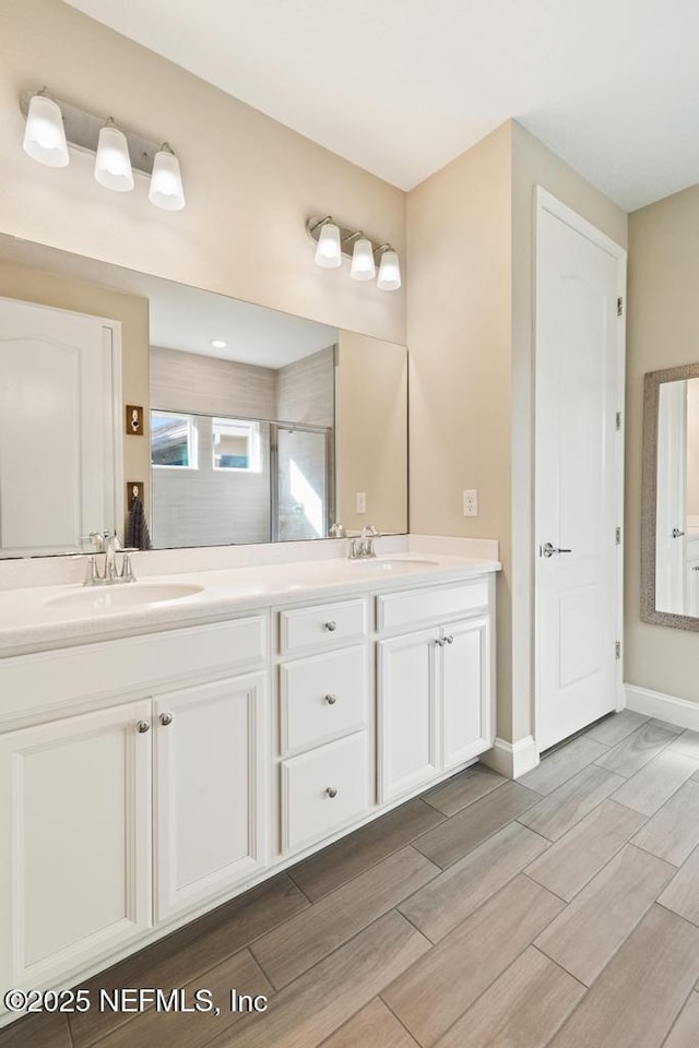 bathroom featuring vanity and walk in shower