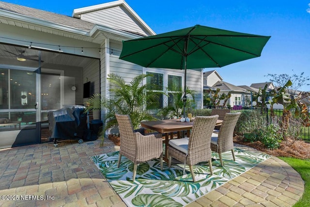 view of patio / terrace featuring outdoor dining area, grilling area, and fence