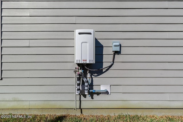 exterior details featuring tankless water heater