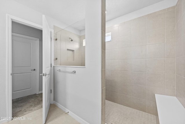 bathroom with tiled shower