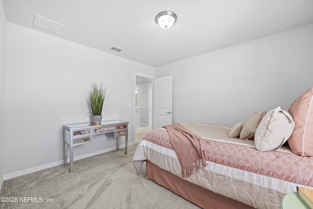 bedroom with light carpet