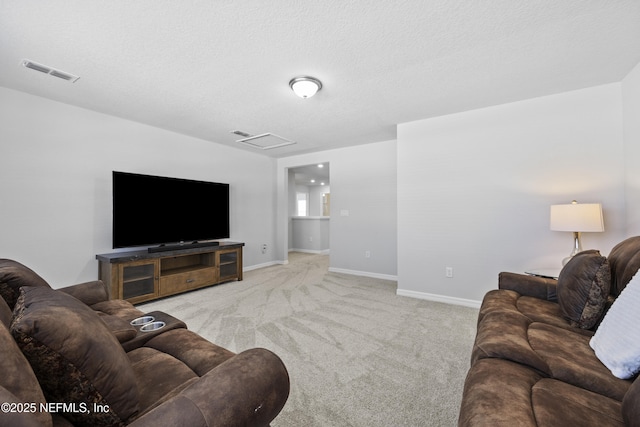 living room with carpet floors and a textured ceiling