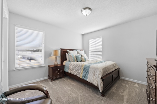 bedroom with light colored carpet